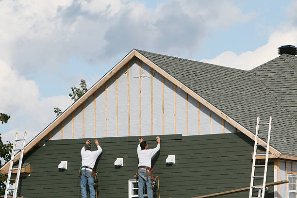 Professional Siding Replacement technician working in Queenstown, MD